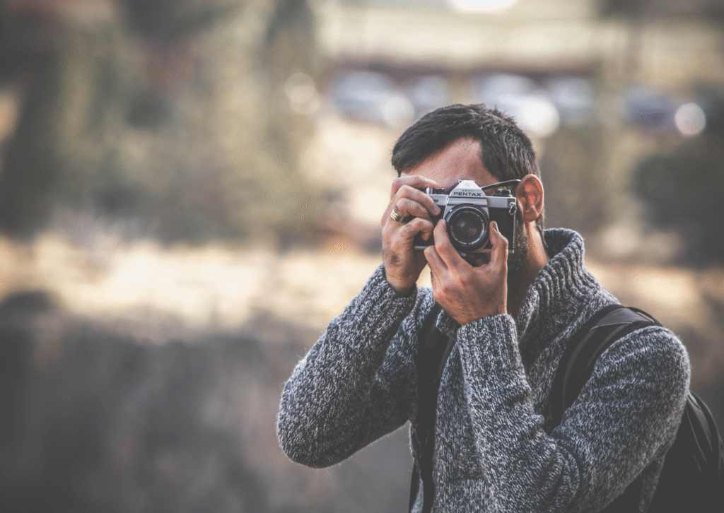 Current image: man taking a photo