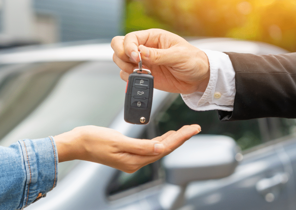 Current image: two hands with a car key
