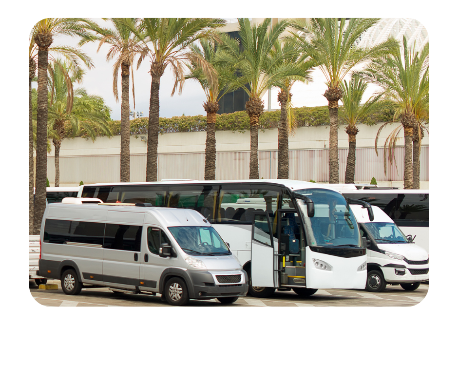 A mini van and a Bus parked